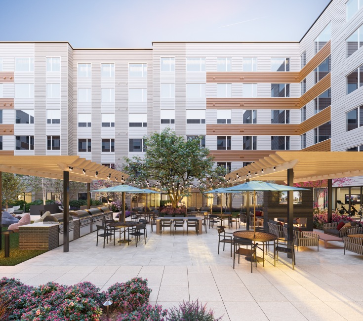 outdoor lounge with seating, umbrellas and beautiful landscaping